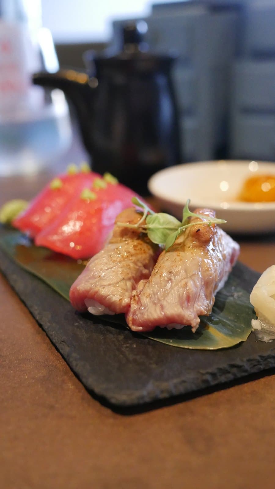 Tuna nigiri and seared wagyu nigiri on a slate board at Azahar, Bella Vista, Panama City