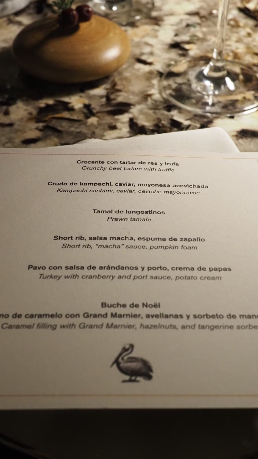 The printed Christmas Day menu at Caleta, listing five courses in Spanish and English
