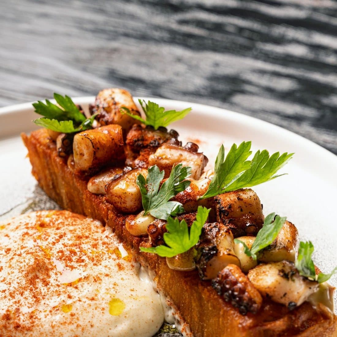 Pulpo a la gallega at Azahar: octopus over a confit potato block with paprika and parsley