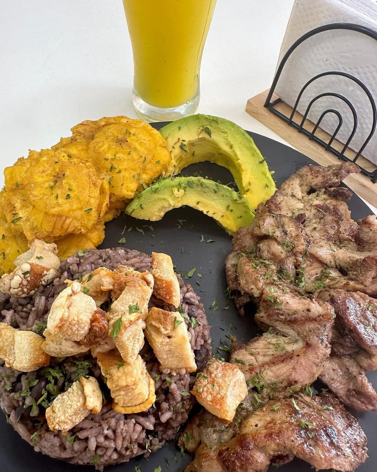 Lunch plate with grilled pork and patacones at Asaky DiOtti Udon y Bento, Panama City