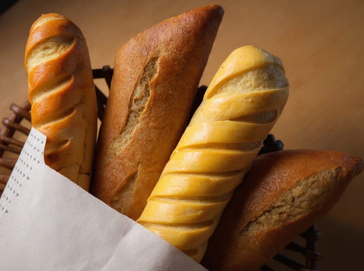 Basket of freshly baked breads and baguettes from the Greek bakery-caf en Athanasiou, Casco Viejo, Ciudad de Panamá