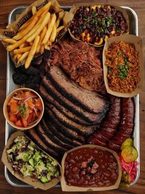 Barbecue tray with sliced brisket, sausage, fries and sides at Austin Mama's, Clayton, Panama City