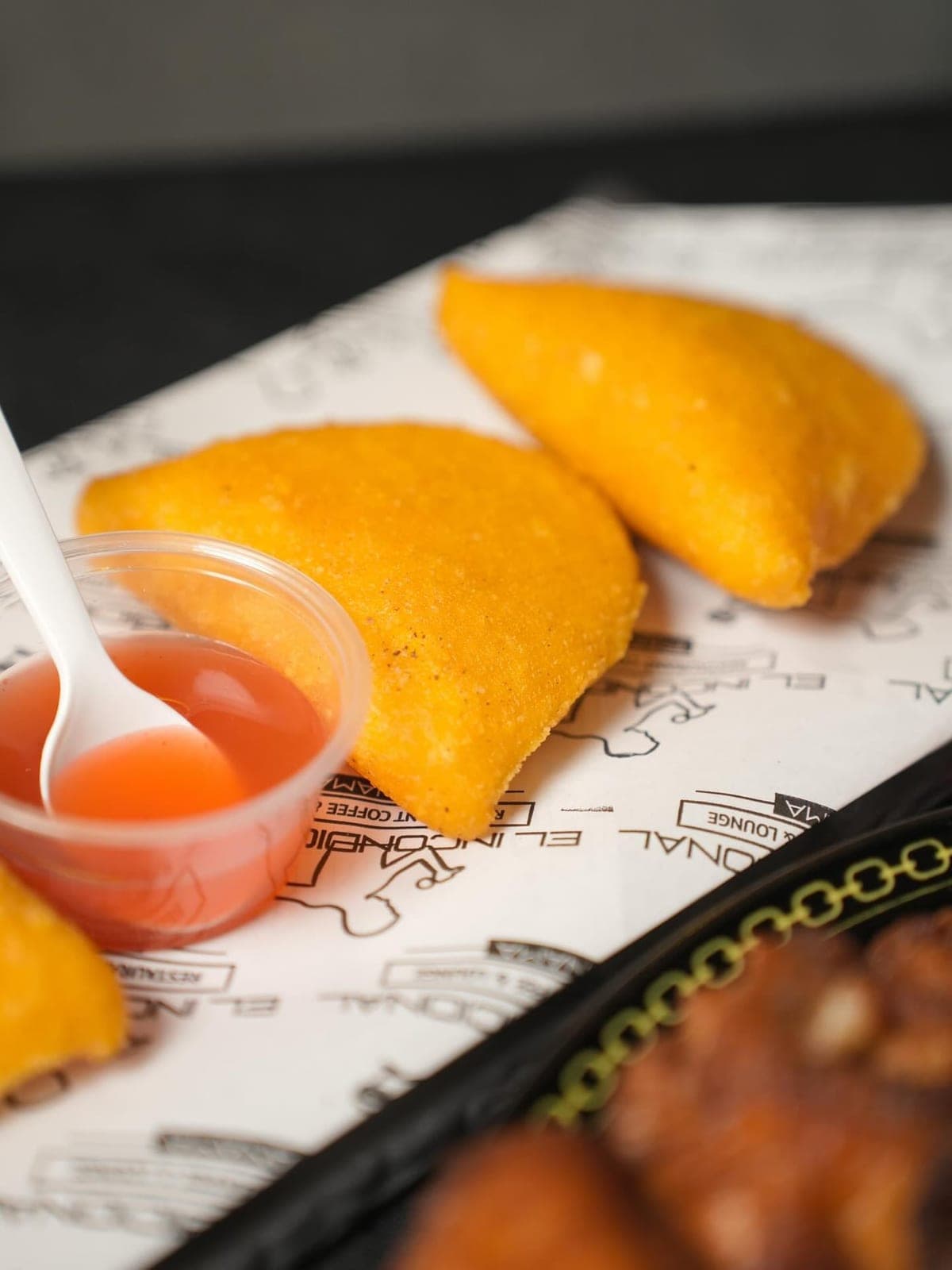 Fried empanadas with dipping sauce at El Incondicional, Marbella, Panama City