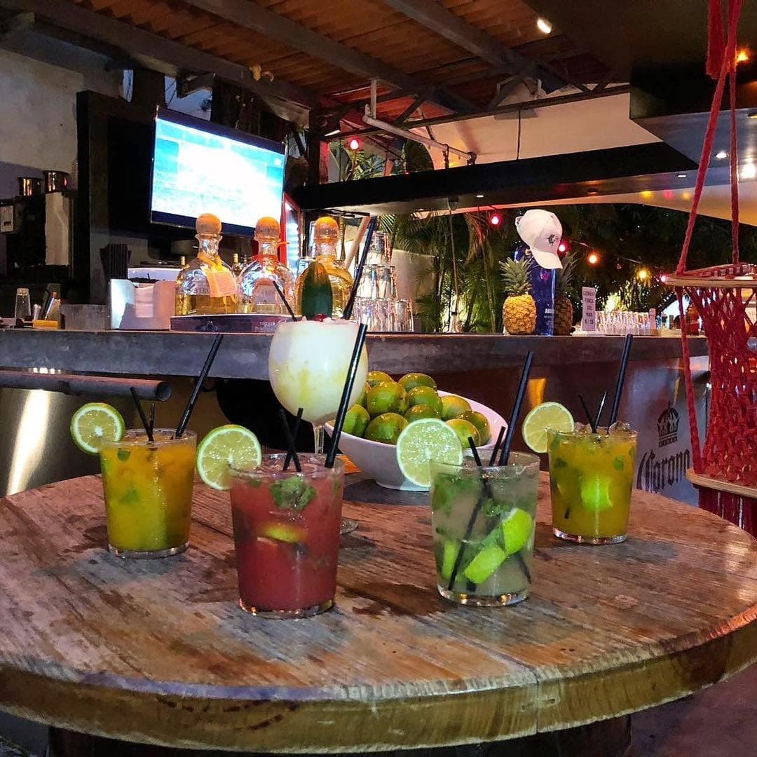 Open-air terrace bar with string lights and palms at Finca del Mar, Casco Viejo, Panama City