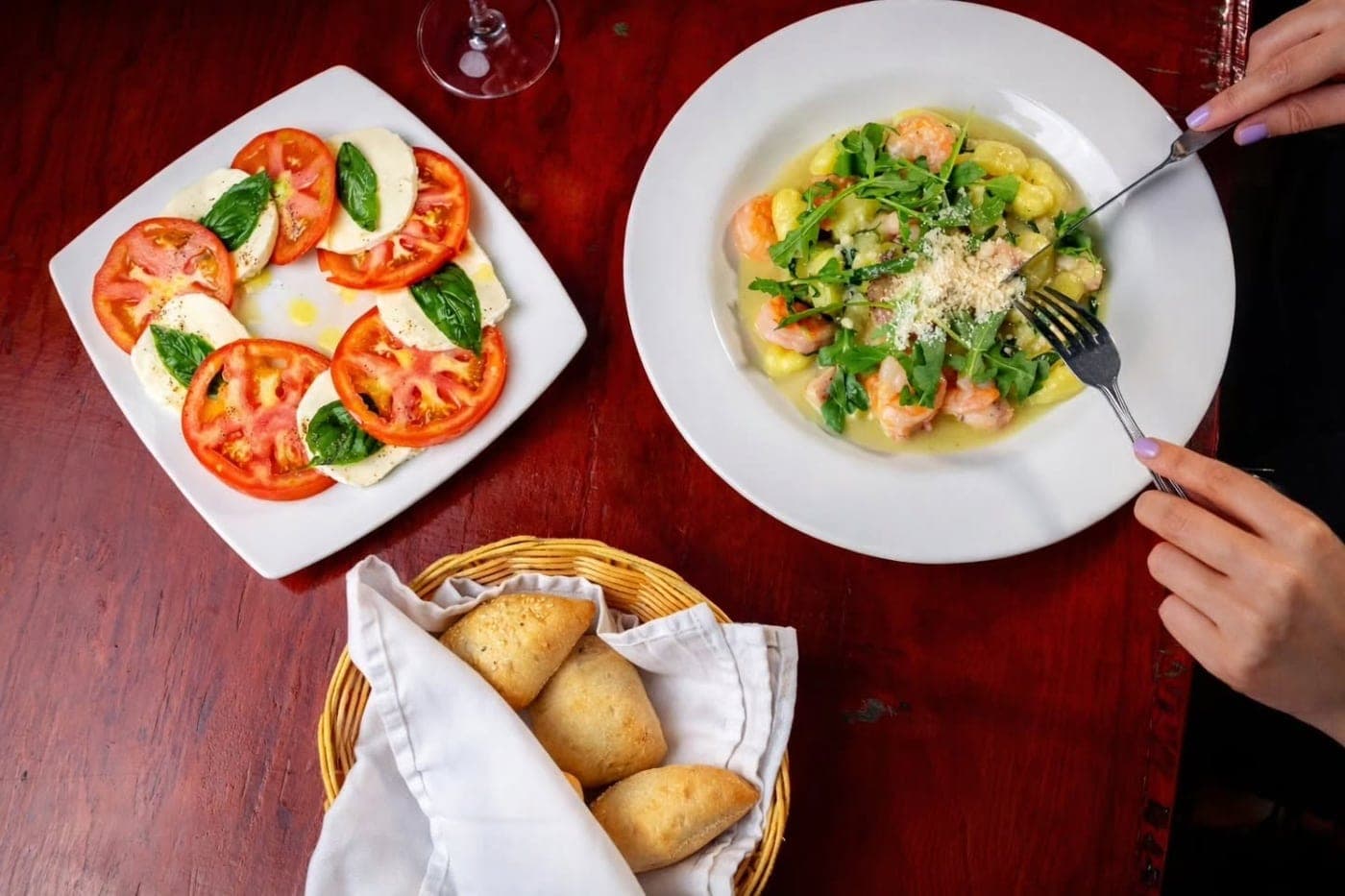 Caprese and shrimp gnocchi at Il Tula, San Francisco, Panama City