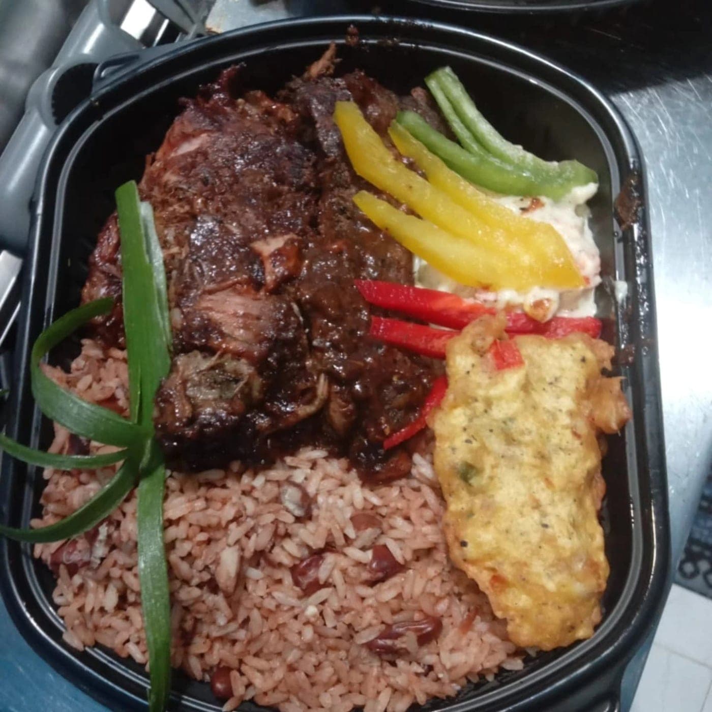 Jerk meat with rice and peas at Jamaican Cuisine, Obarrio, Panama City