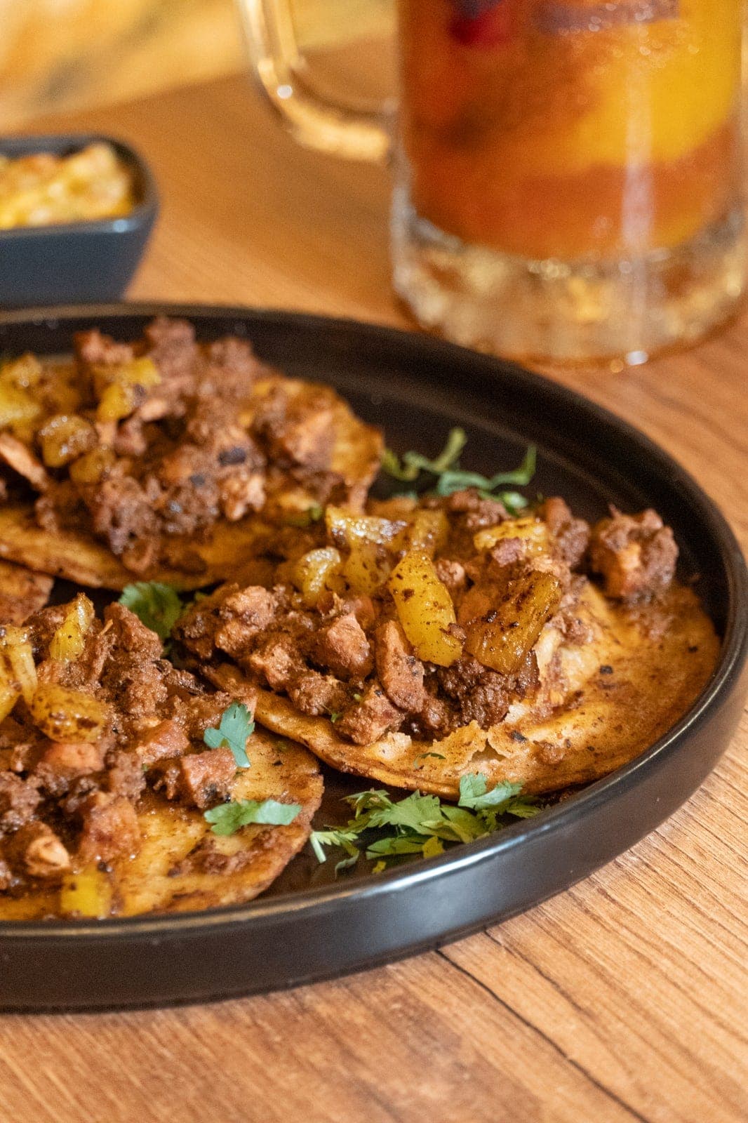 Plate of tacos al pastor with pineapple and cilantro at La Pinche Cantina, Casco Viejo, Panama City