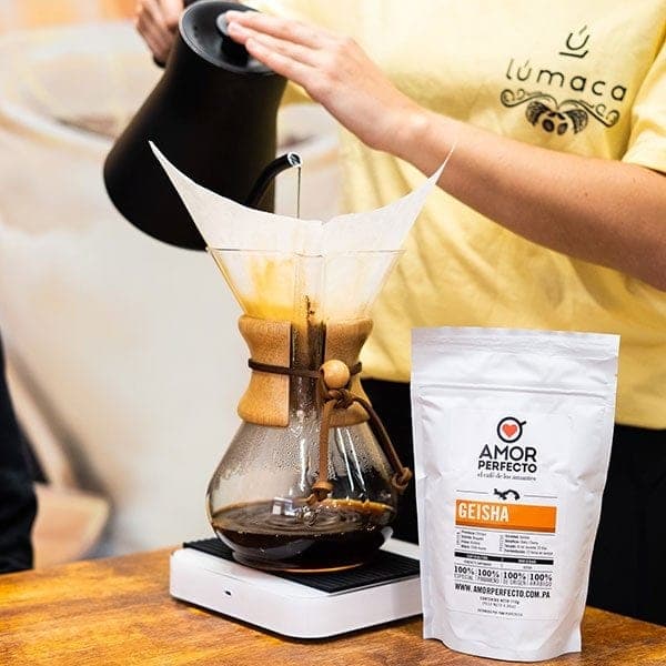 Chemex pour-over brewing beside a Geisha coffee bag at Lumaca, Casco Viejo, Panama City