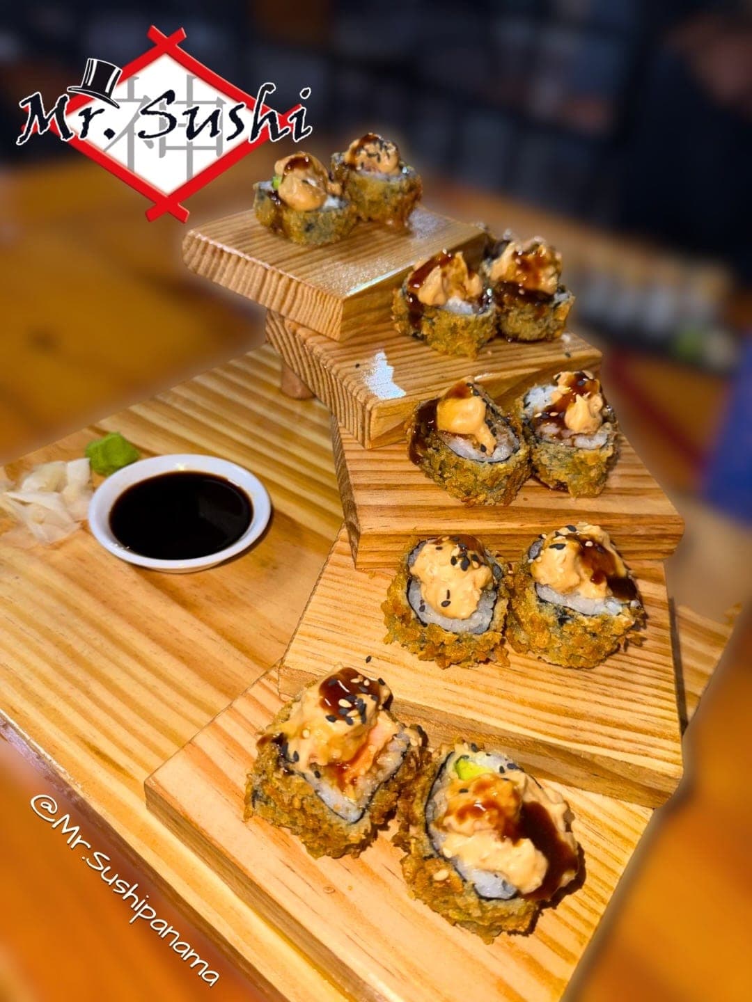 Crispy tempura sushi rolls on a tiered display at Mr. Sushi, Costa del Este, Panama City