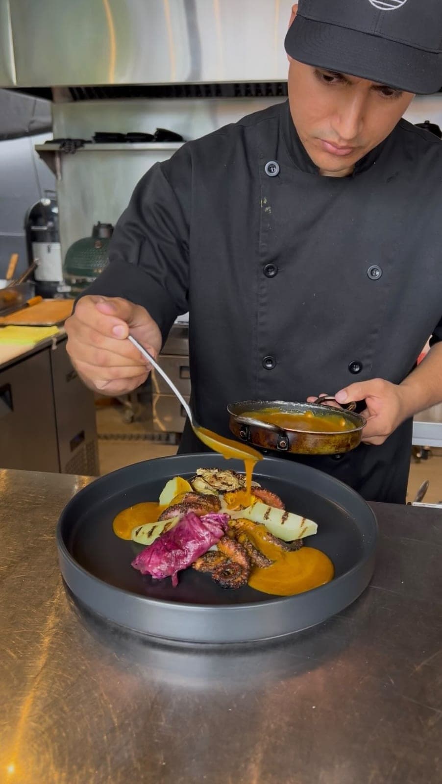 Grilled octopus being plated at Octo Smokehouse, San Francisco, Panama City