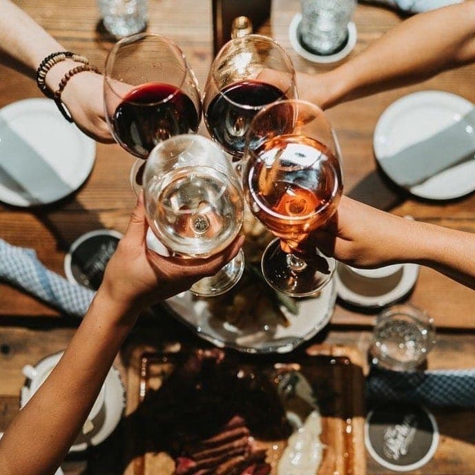 Wine toast over a steak table at Parrillada Martin Fierro, El Cangrejo, Panama City