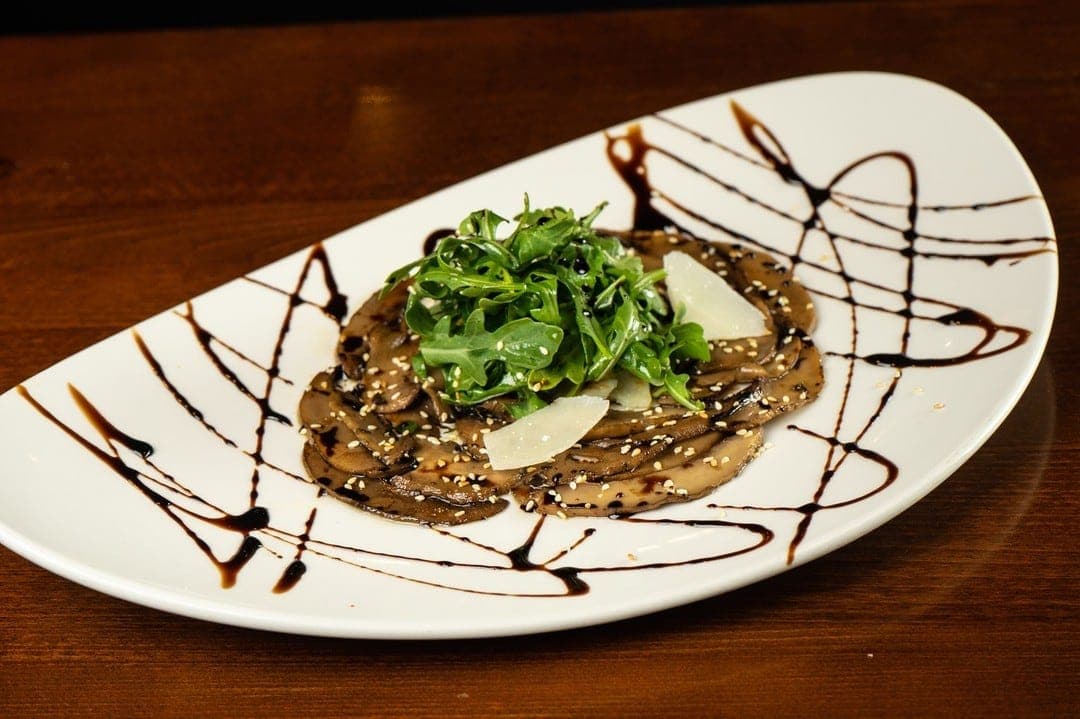 Portobello carpaccio with parmesan and balsamic at Petit Bistro, Panama City