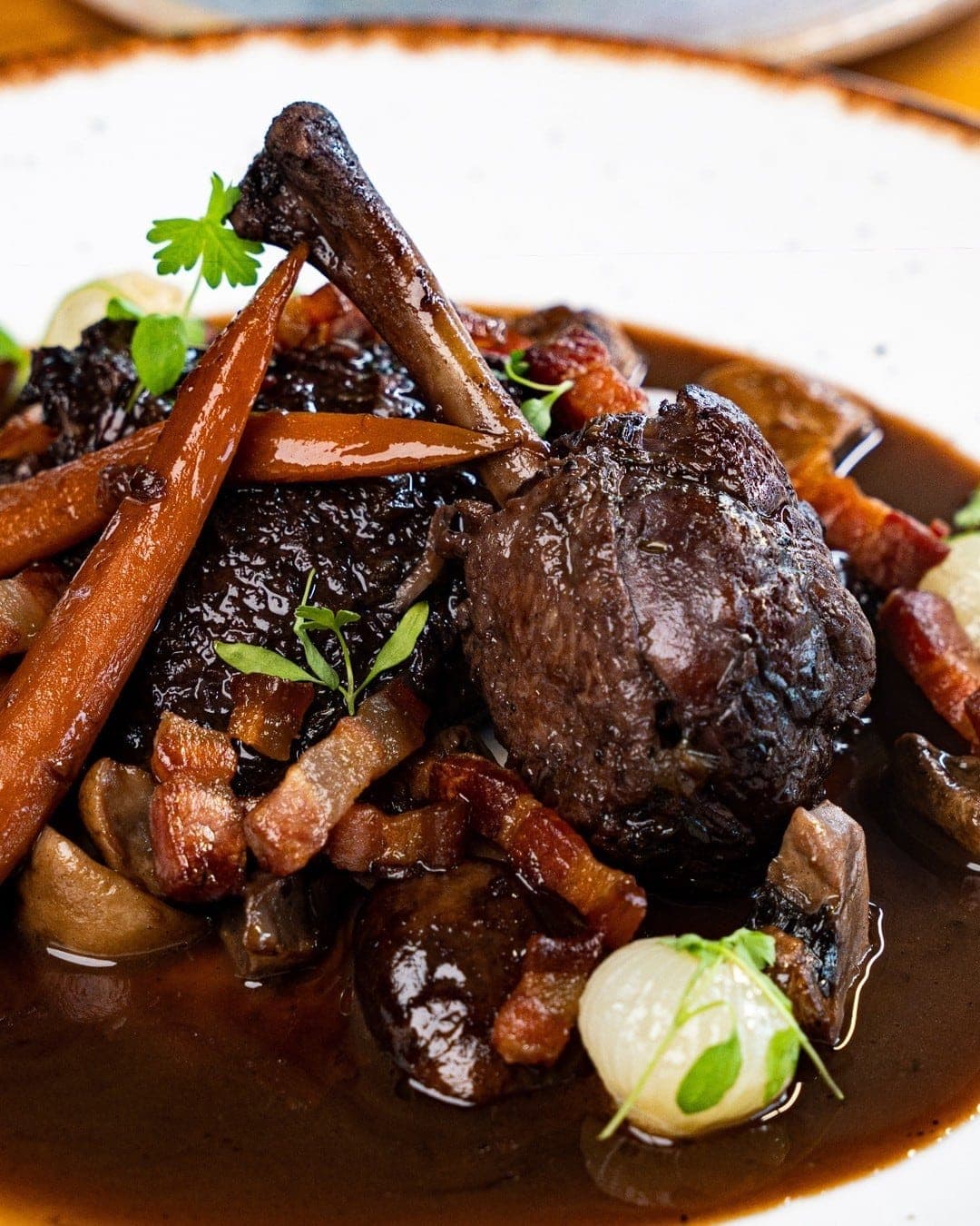 French braised chicken dish at Petit Paris Bistro, Marbella, Panama City