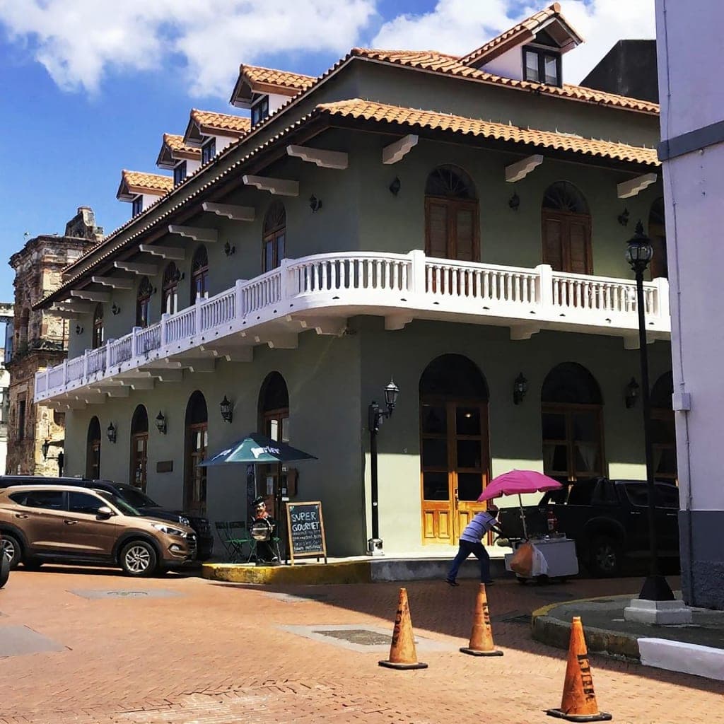 Storefront with the orange Super Gourmet coffee-shop sign in Casco Viejo, Panama City