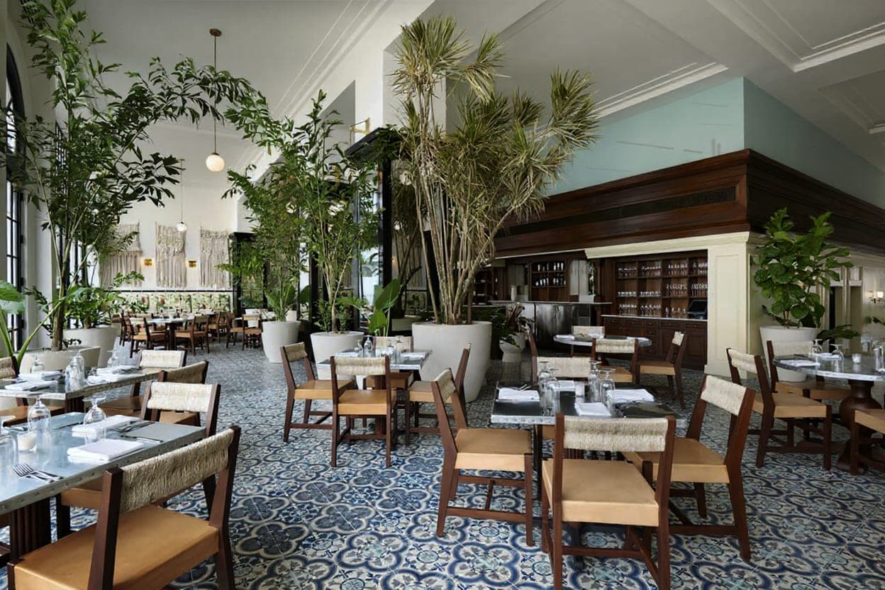Dining room interior with set tables and patterned cement-tile floor at The Dining Room, American Trade Hotel, Casco Viejo, Panama City