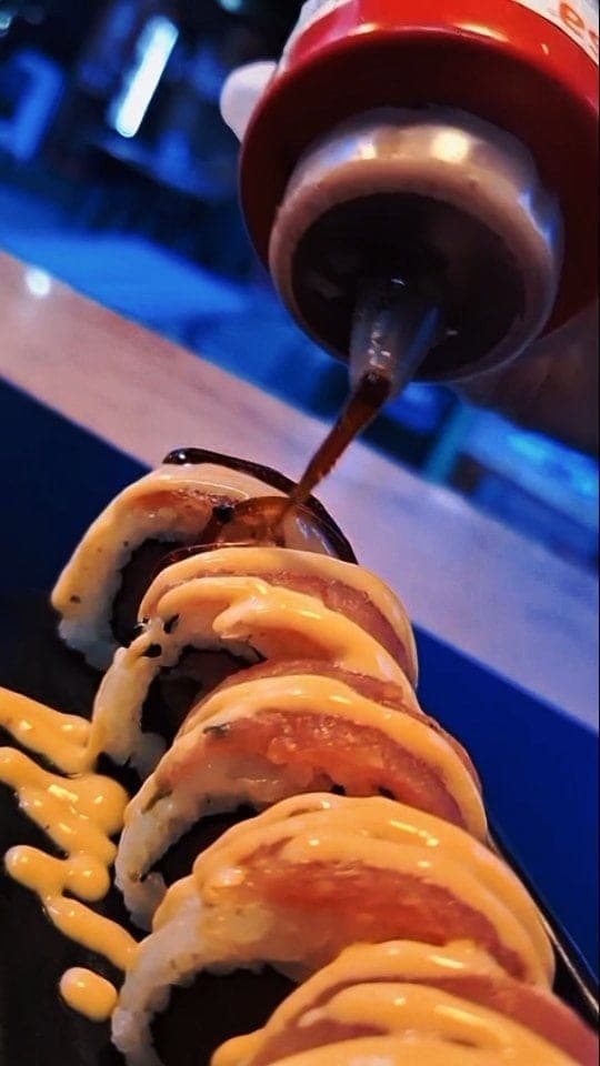 Sushi roll with sauce at Uashi, Bella Vista, Panama City
